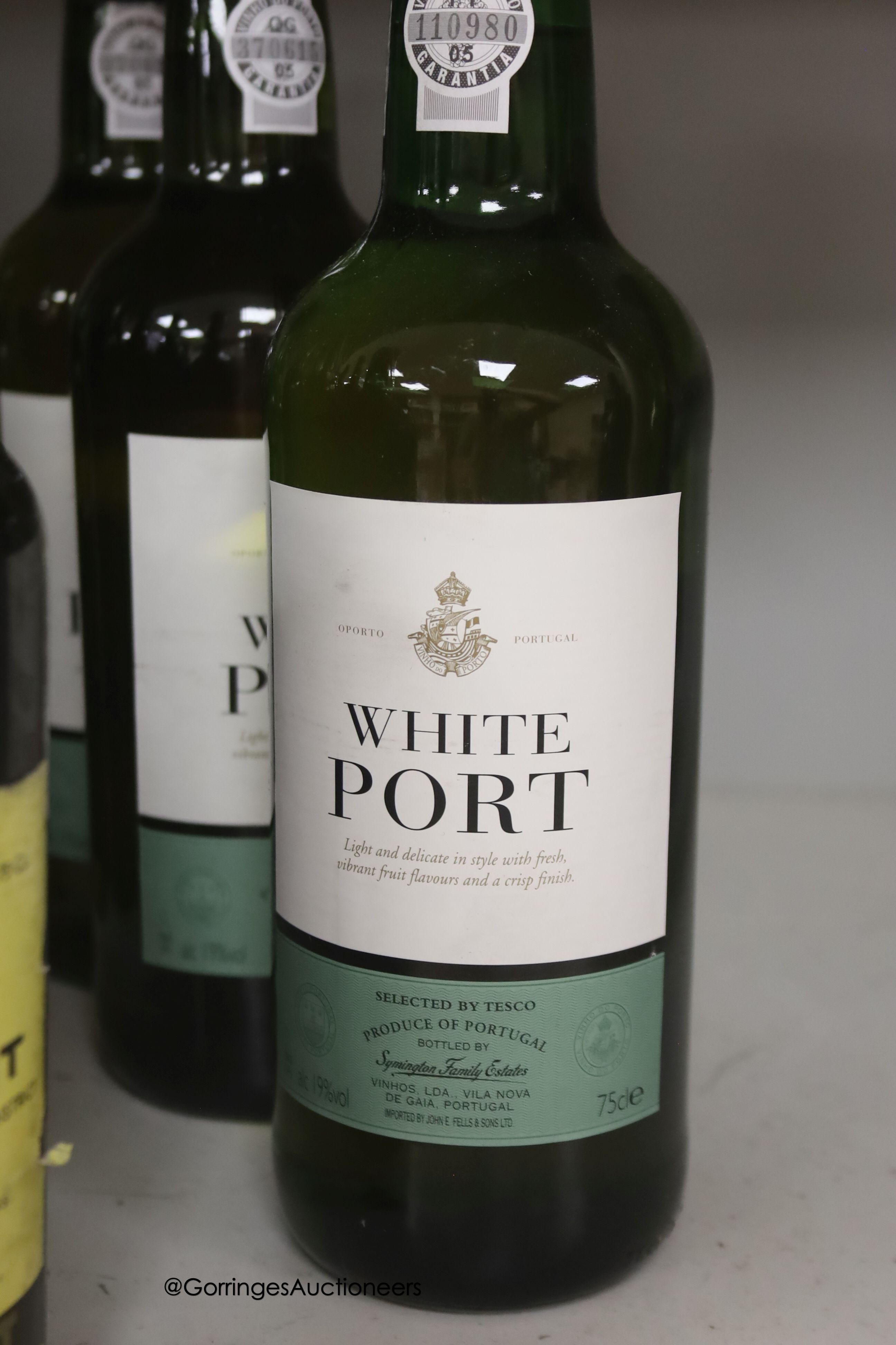 Thirteen assorted bottles of Port including Dow's 1975 and 1977 and one bottle of Magloire Calvados